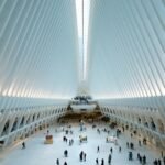 Modern architectural view of the Oculus in NYC, showcasing its futuristic design and bustling interior.